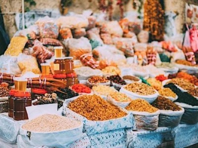 Tbilisi, Georgia. Market Bazar Abundant Counter Of Dried Fruit And Jars Of Honey On Sale.